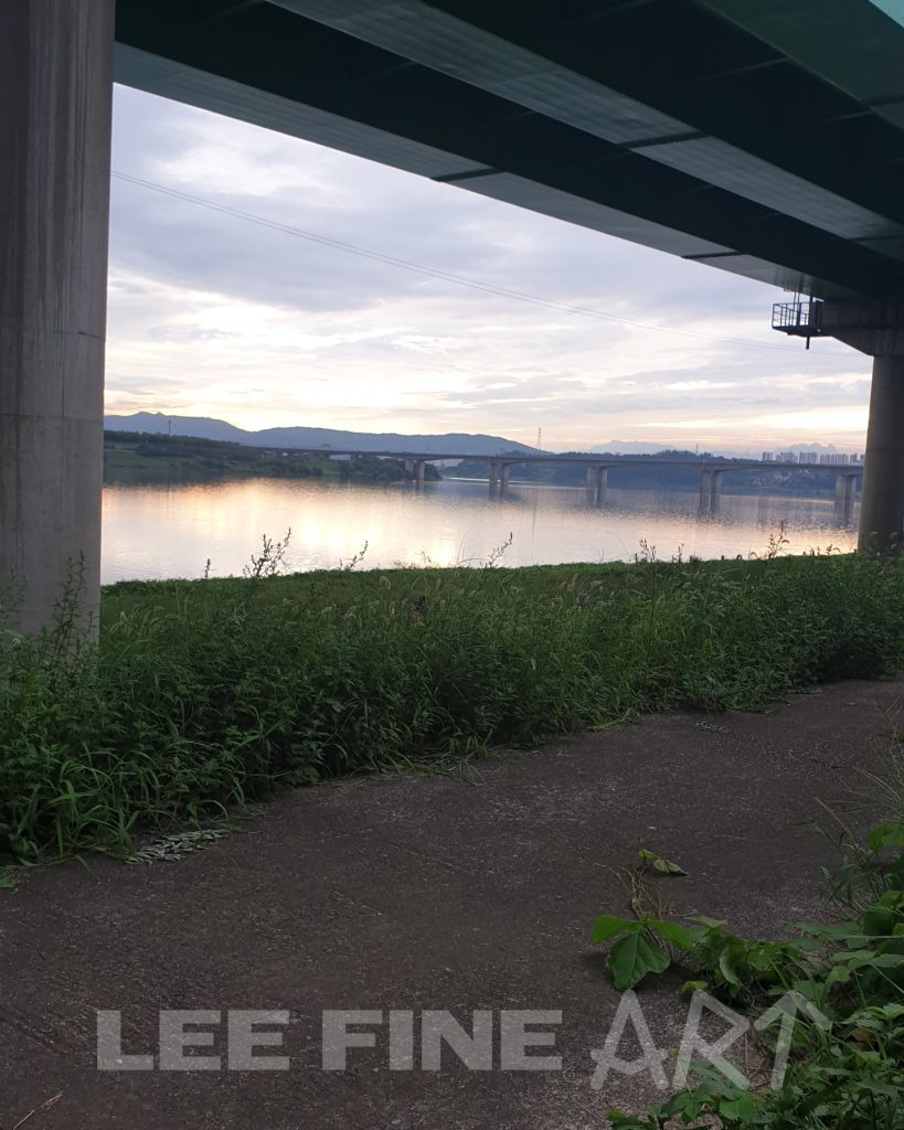 view of under a highway overpass looking at at the han river